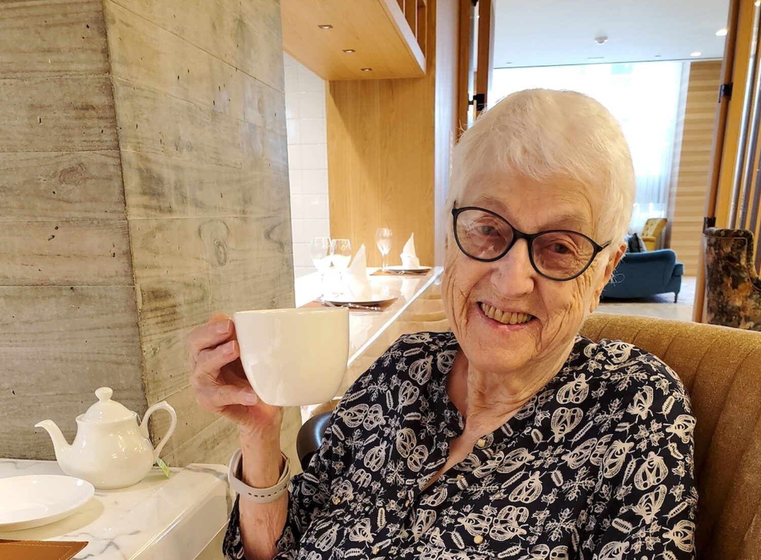 senior lady smiling with tea cup