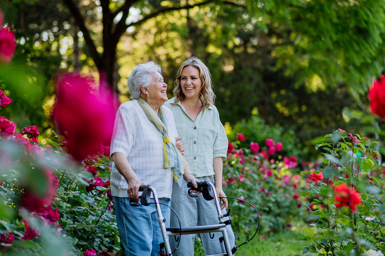 Granddaughter with grandmother in garden
