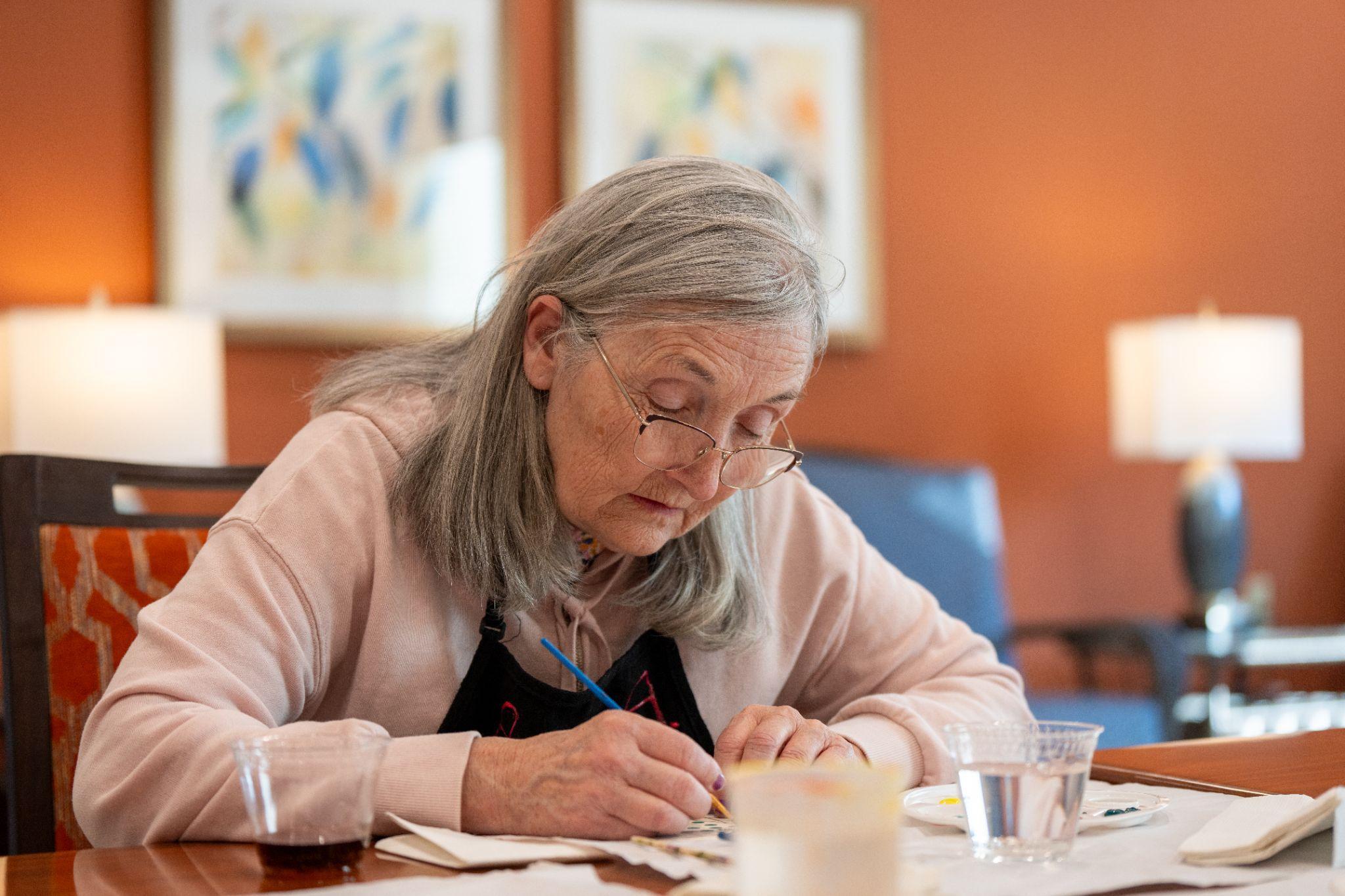senior woman at table