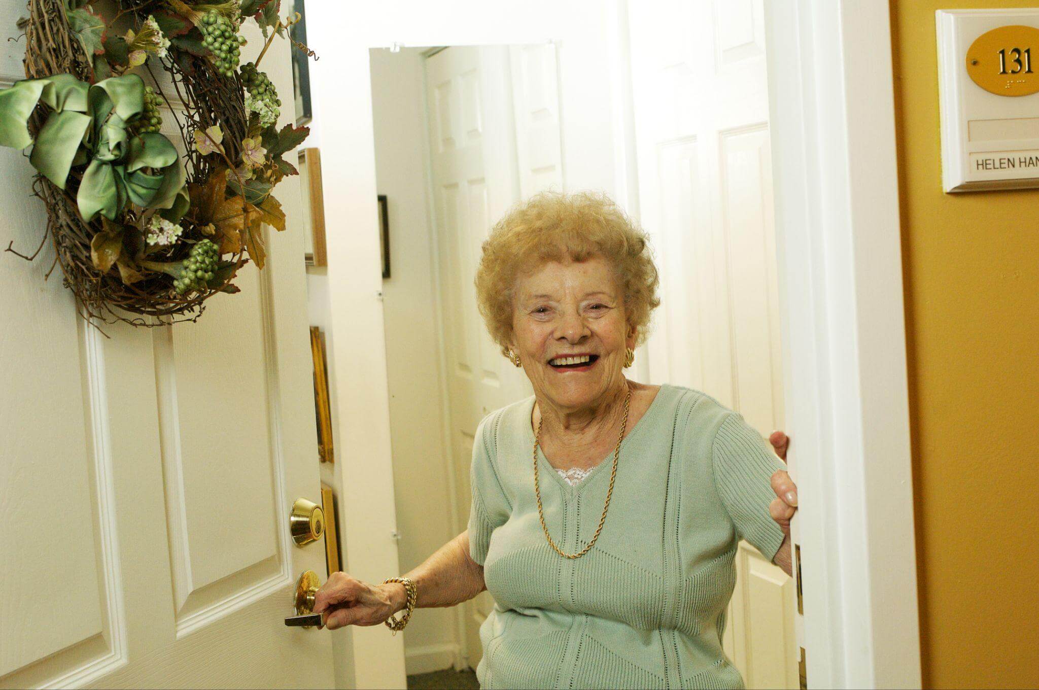 Woman walking into her new home