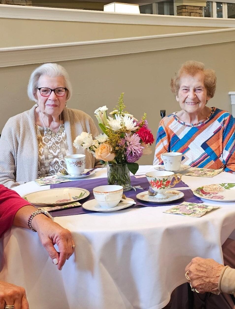 residents sitting at a dining table